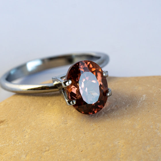 warm but dark toned natural zircon with a hint of peach undertone