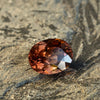 warm but dark toned natural zircon with a hint of peach undertone