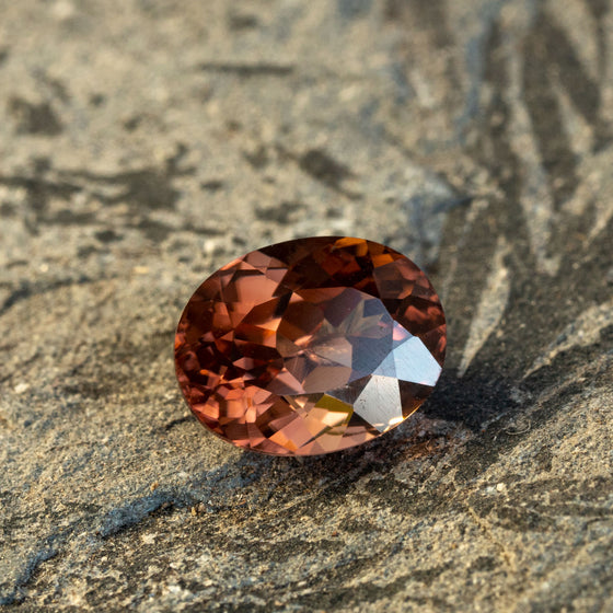 warm but dark toned natural zircon with a hint of peach undertone