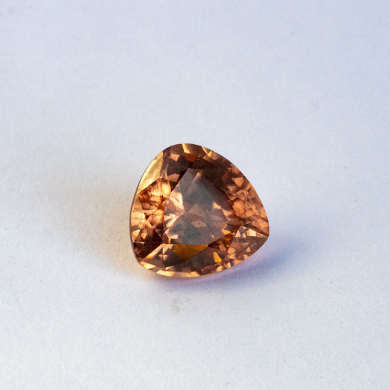 This stunning natural zircon has fantastic sparkle and beautiful golden hue with an ever so slight hint of peach
