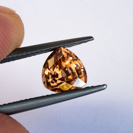 This stunning natural zircon has fantastic sparkle and beautiful golden hue with an ever so slight hint of peach