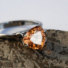  This stunning natural zircon has fantastic sparkle and beautiful golden hue with an ever so slight hint of peach