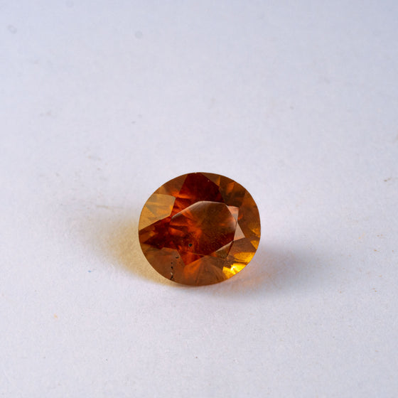 This warm toned natural zircon has a burnt amber feel about its colour