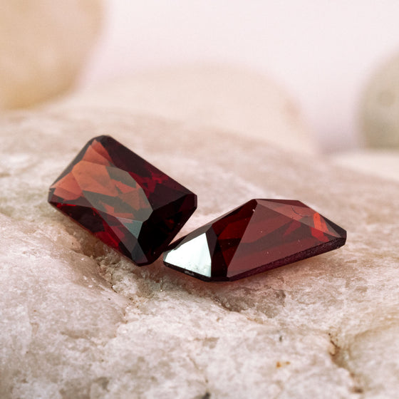 pair of garnets are a deep burgandy with a hint of orange. This pair are unheated and were responsibly sourced as rough gems from Mozambique