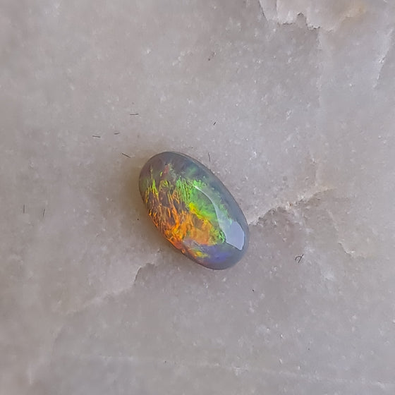 0.67ct Oval Cut Semi-Black Opal Cabochon