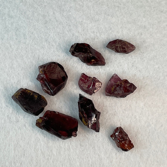 This is nice clean material in a variety of dark purplish hues. Most piece will cut a deep, dark, but very rich coloured stone.