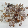 This Australian Zircon Rough has a mixture of pale pinkish, yellowish and near colourless stones. Most are lightly to moderately included. These have not been treated in any way other than being tumbled.
