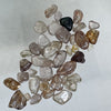 This Australian Zircon Rough has a mixture of pale pinkish, yellowish and near colourless stones. Most are lightly to moderately included. These have not been treated in any way other than being tumbled.